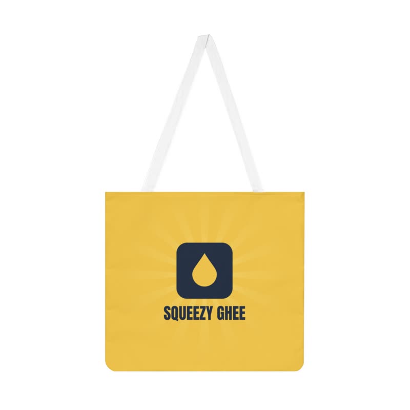 Butter-yellow tote bag carrying the mark and SQUEEZY GHEE, with a faint sunburst behind it.